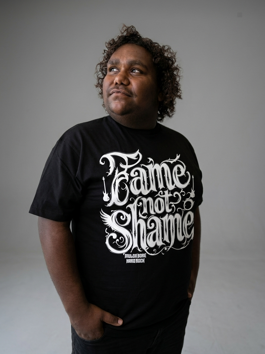 Alvin wearing a black t-shirt with 'Fame not Shame' text on a plain background